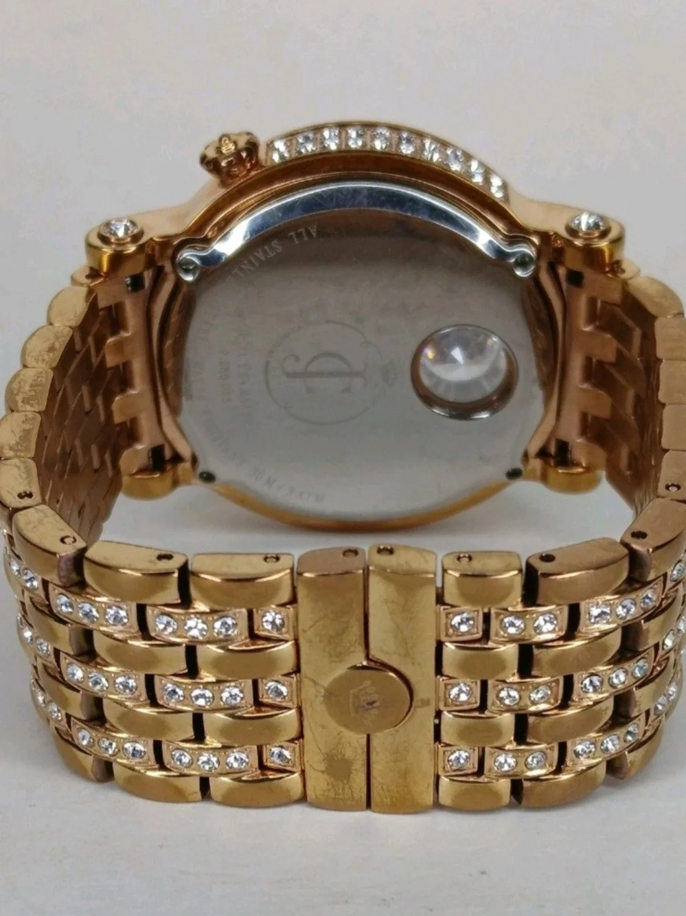 ​Juicy Couture Gold Tone Crystal Bezel Floating Solitaire Watch